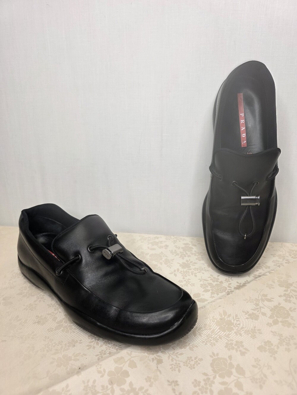 Prada Black Leather Slip-On Loafers with Silver Accent